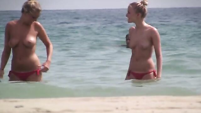Pretty Twin Sisters Topless on the Vacation - 1 image