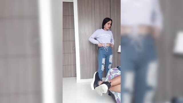 Sister Measuring clothes in front of her Brother - 5 image